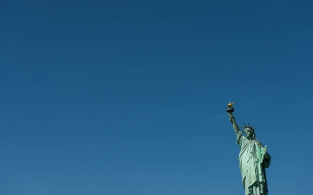 Statue of Liberty against a clear sky, representing protection sought through asylum in the United States