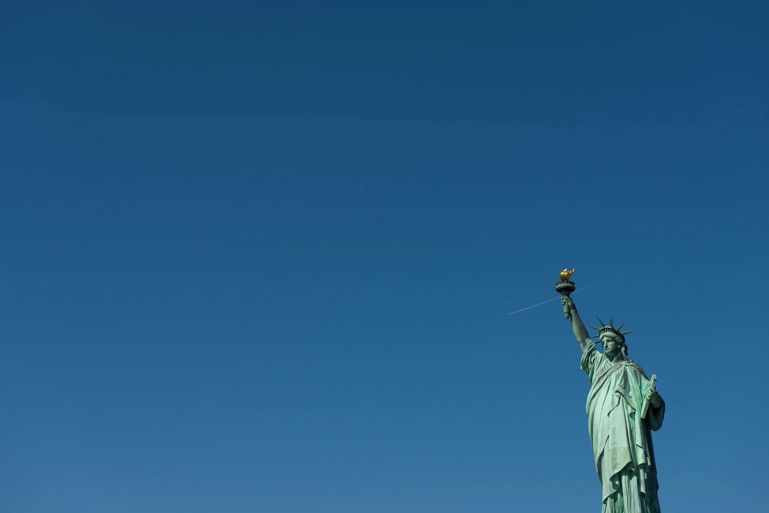 Statue of Liberty against a clear sky, representing protection sought through asylum in the United States