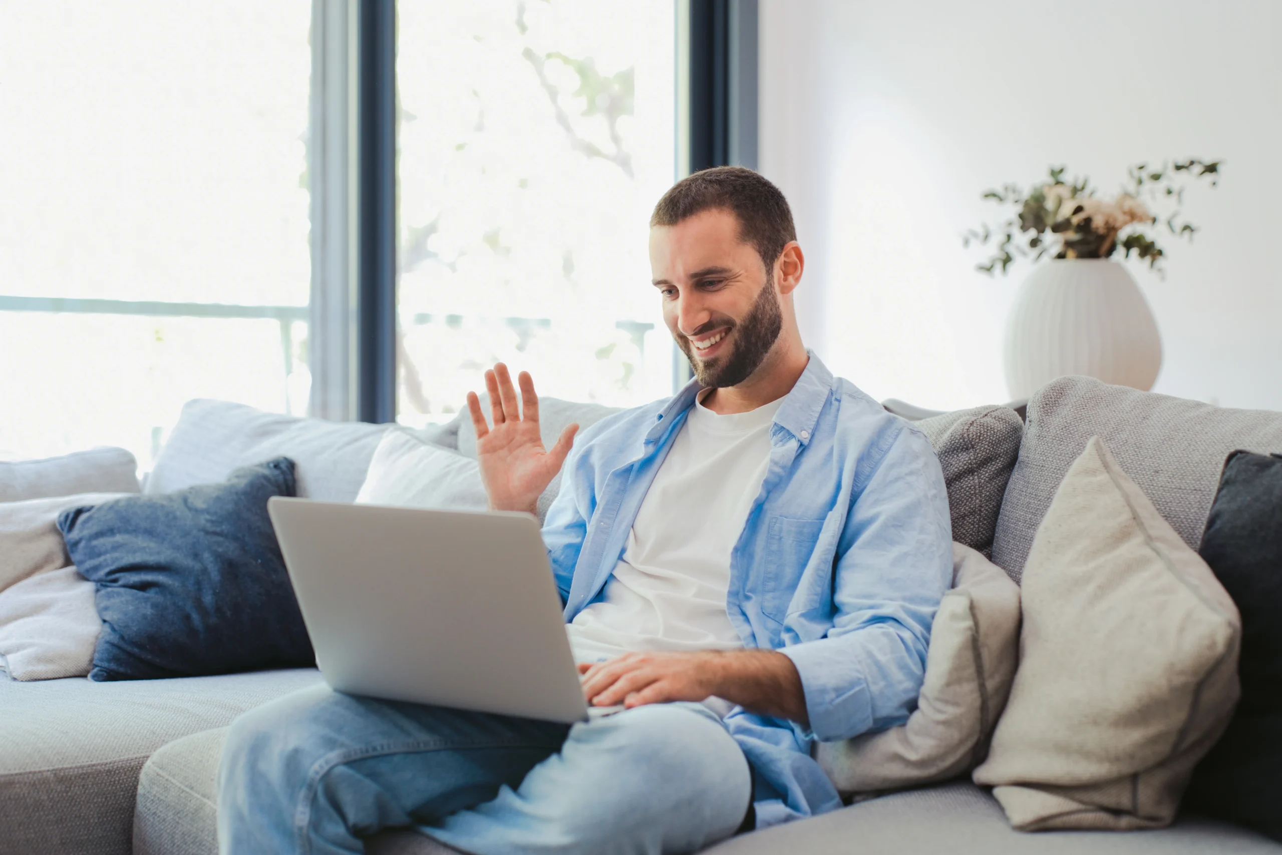 Man on a private video call from home during a confidential T visa evaluation